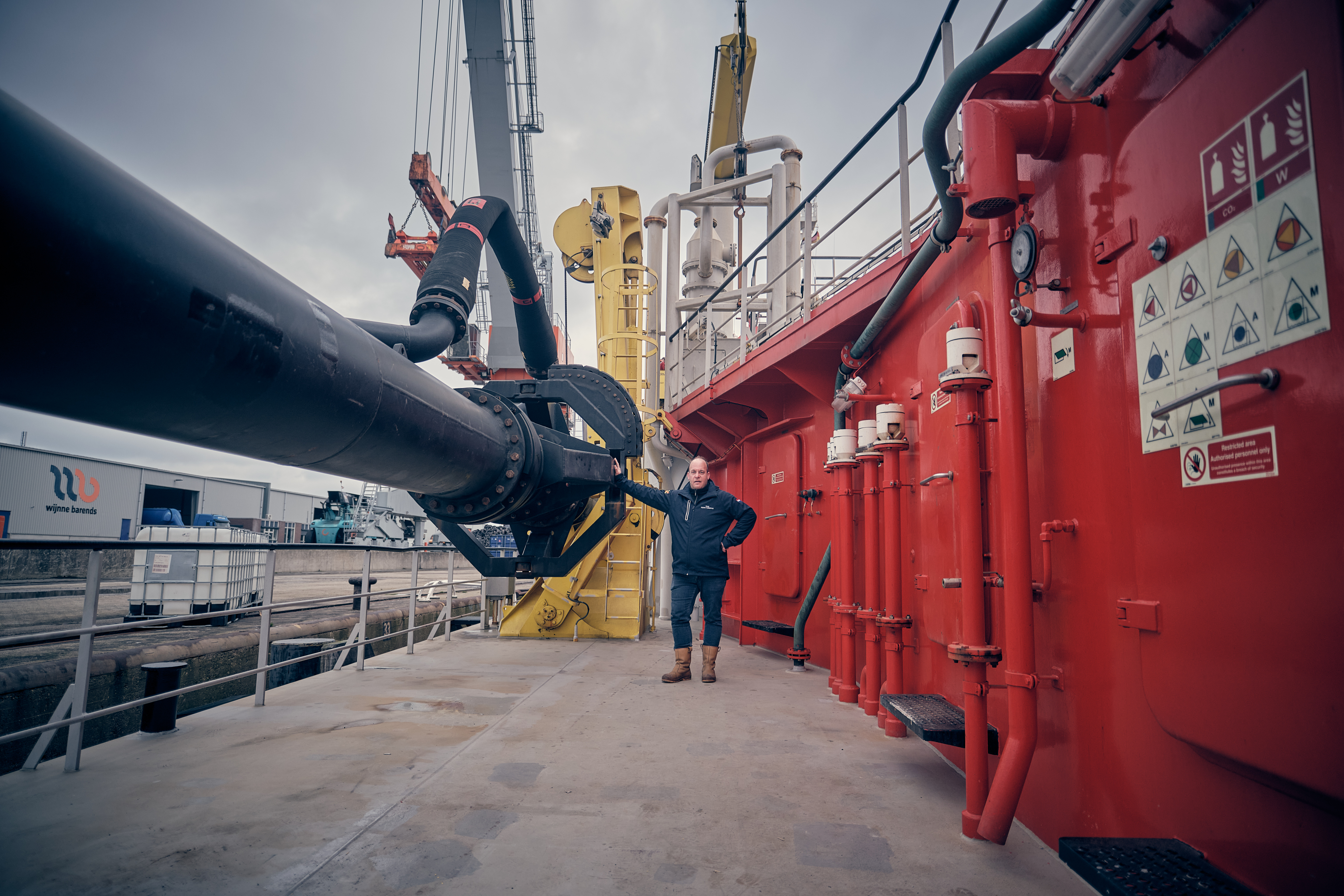 Niels Hooites next to suction pipe at TSHD Beagle® 4 TEUNIS HUIBERTUS 